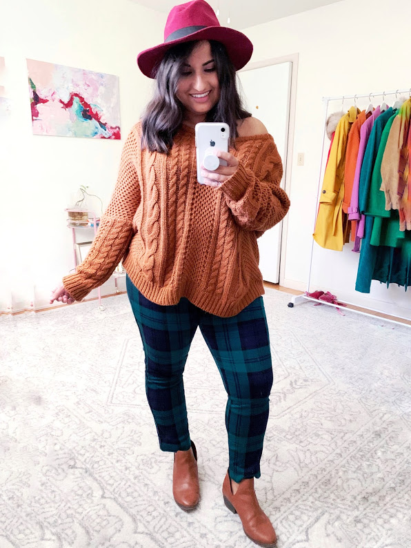 dina in green plaid pants and a brown sweater