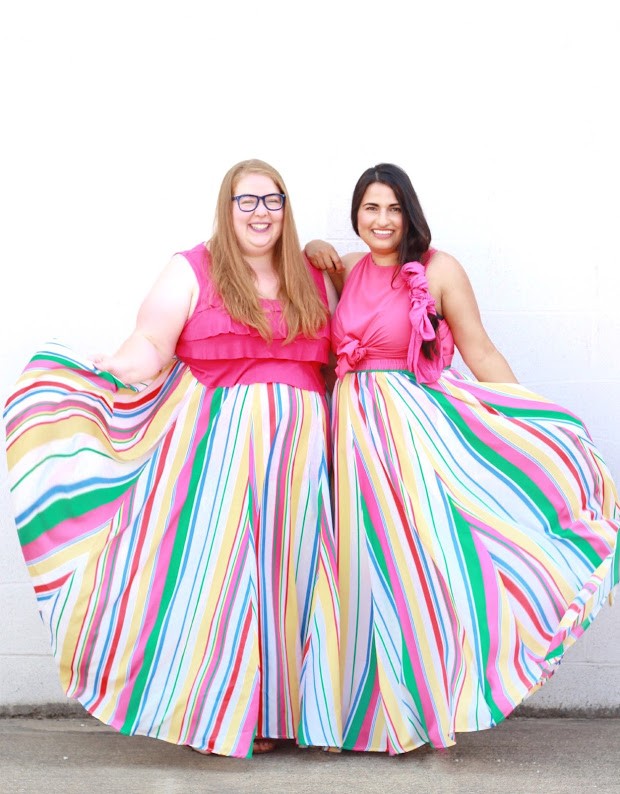 Shannon and Dina wearing matching rainbow print skirts and pink shirt
